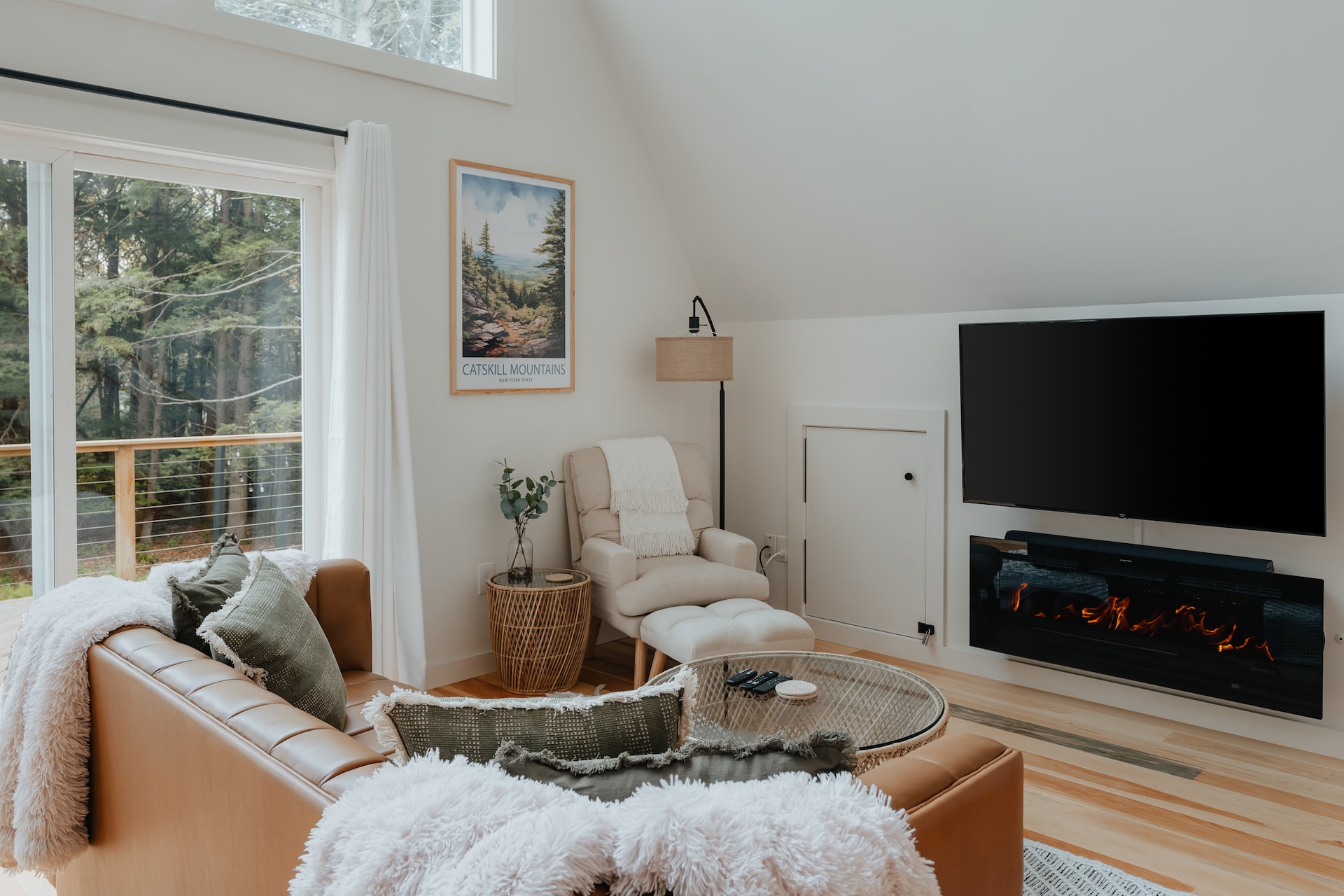 a living room filled with furniture and a flat screen tv